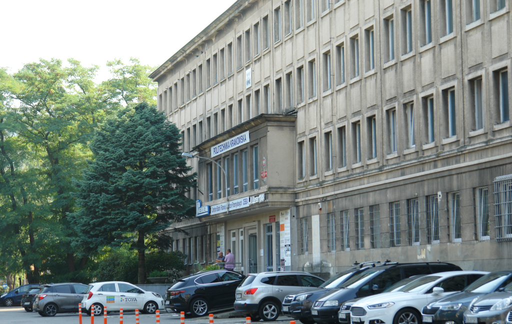 Kraków University of Technology building on Lea Street in Kraków. A large, grey office building.  