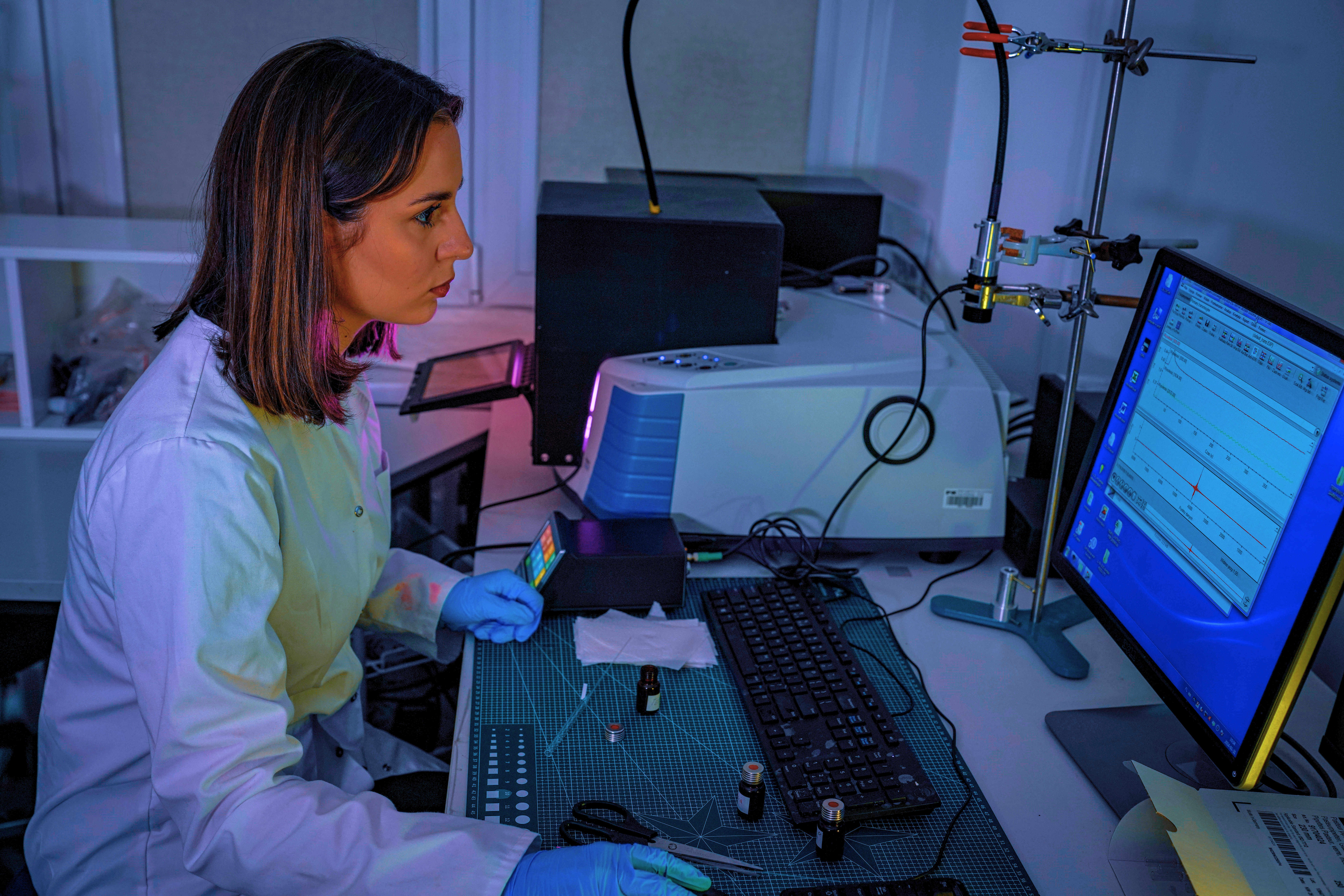 PK CUT researcher working in a computer equipped lab