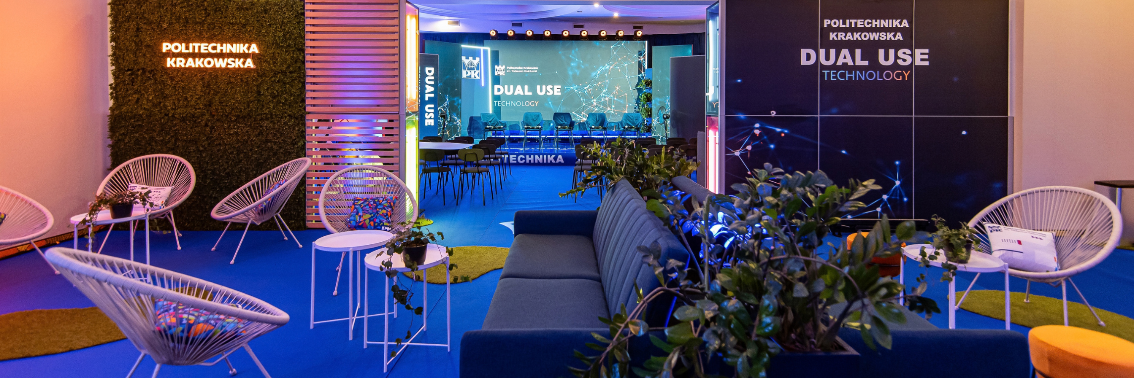 A modern conference venue with a stage and a networking area